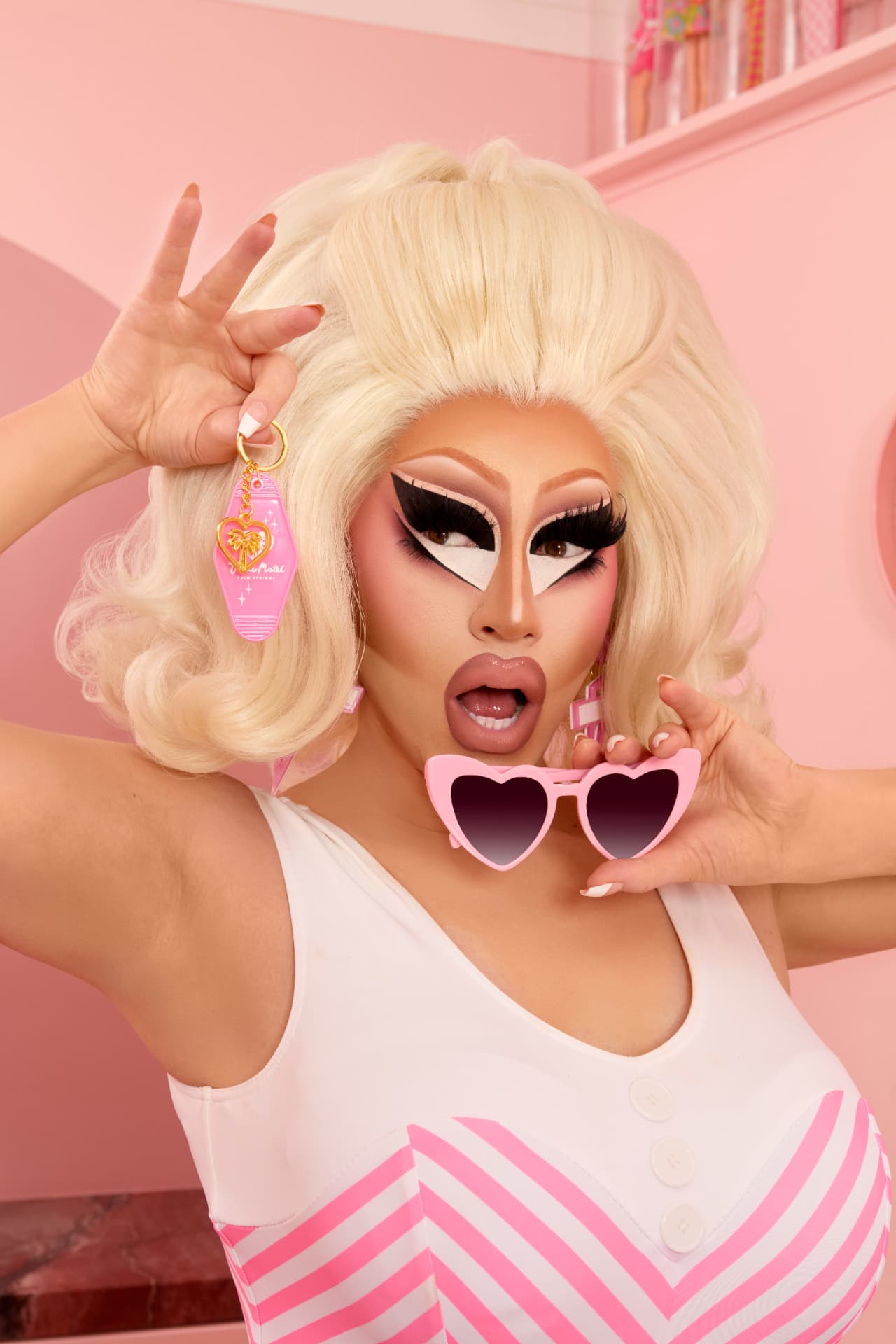 Trixie with the motel keychain and heart sunglasses